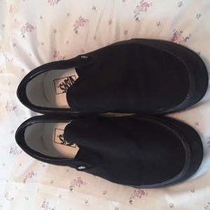 Vans mens 9.5 M/womens 11M. Black Canvas slip on's